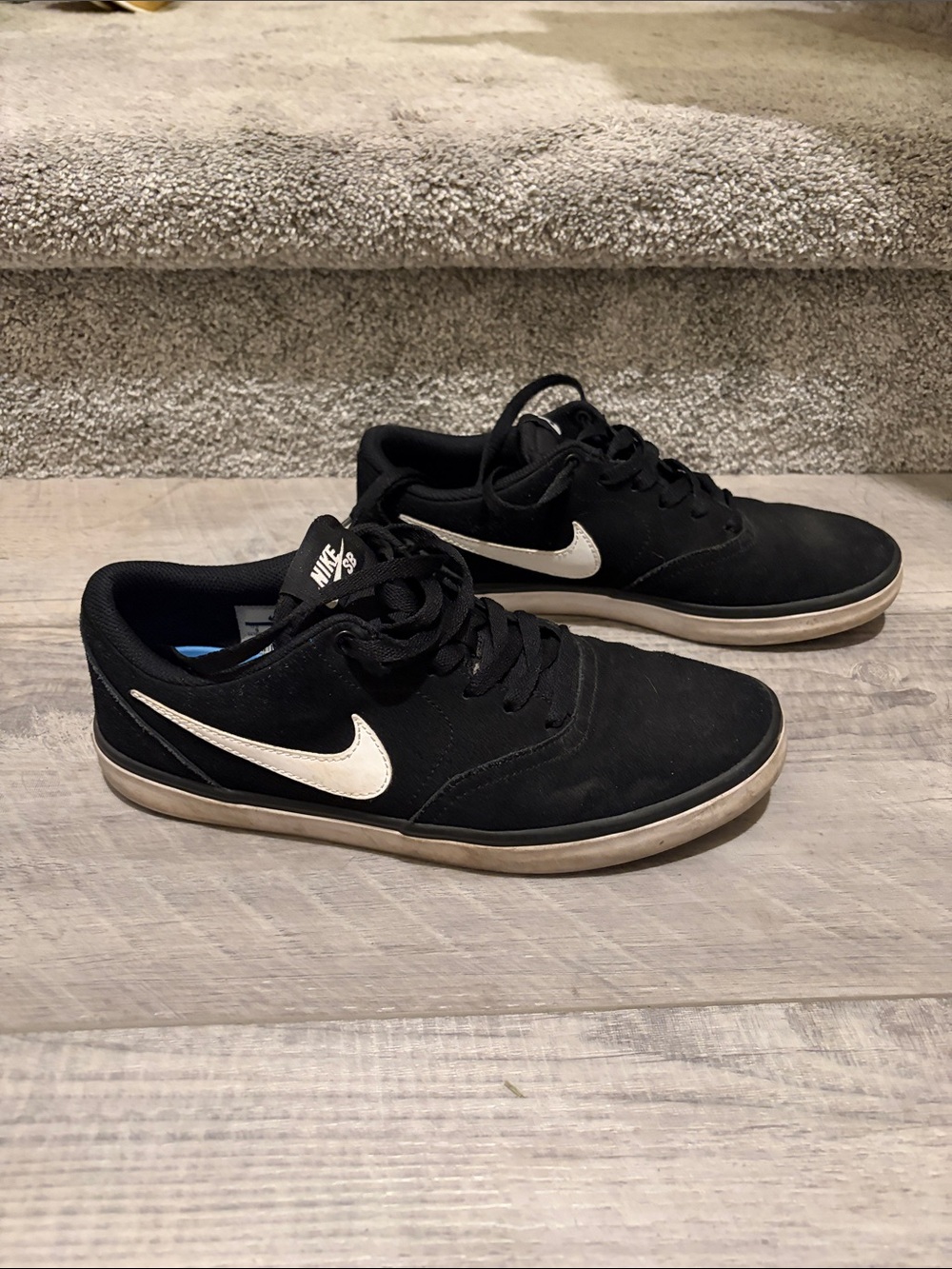 Nike Black Low-Top Sneakers with White Swoosh